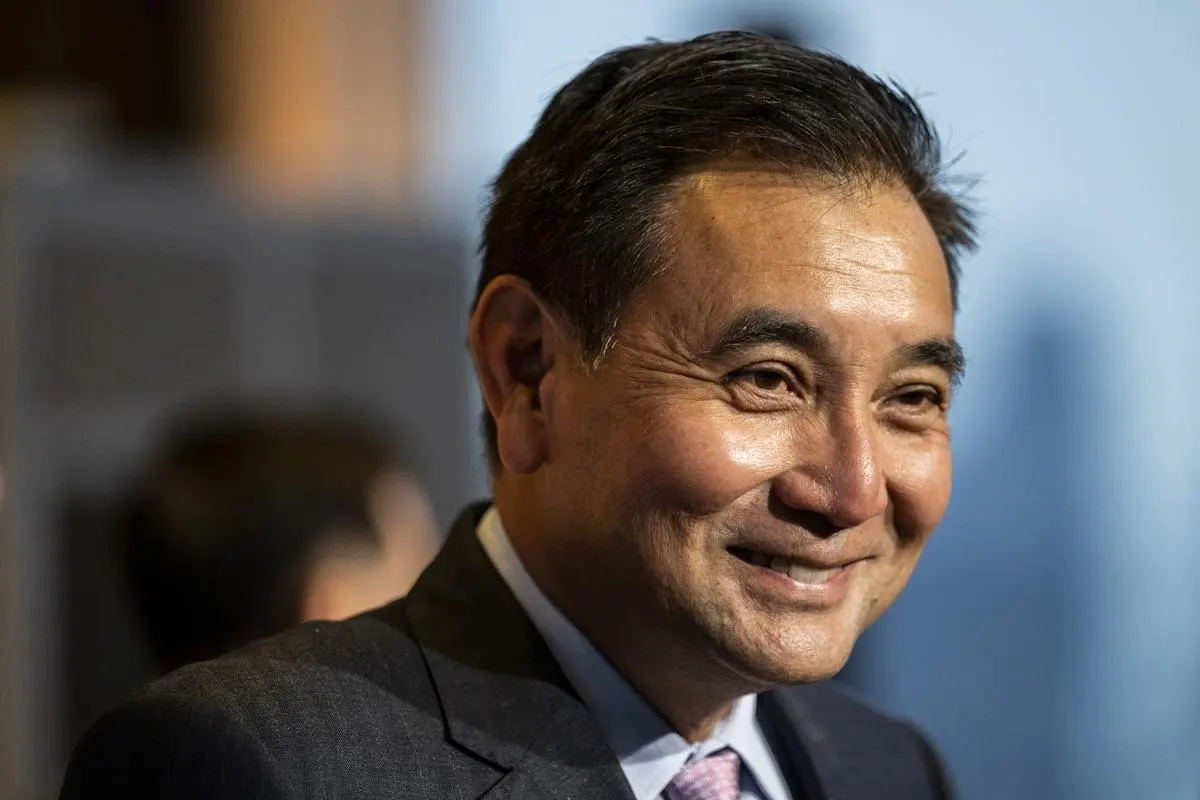 A Thai billionaire businessman smiles during an event