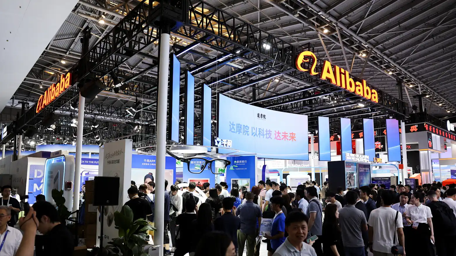 Crowds at an Alibaba technology exhibition booth