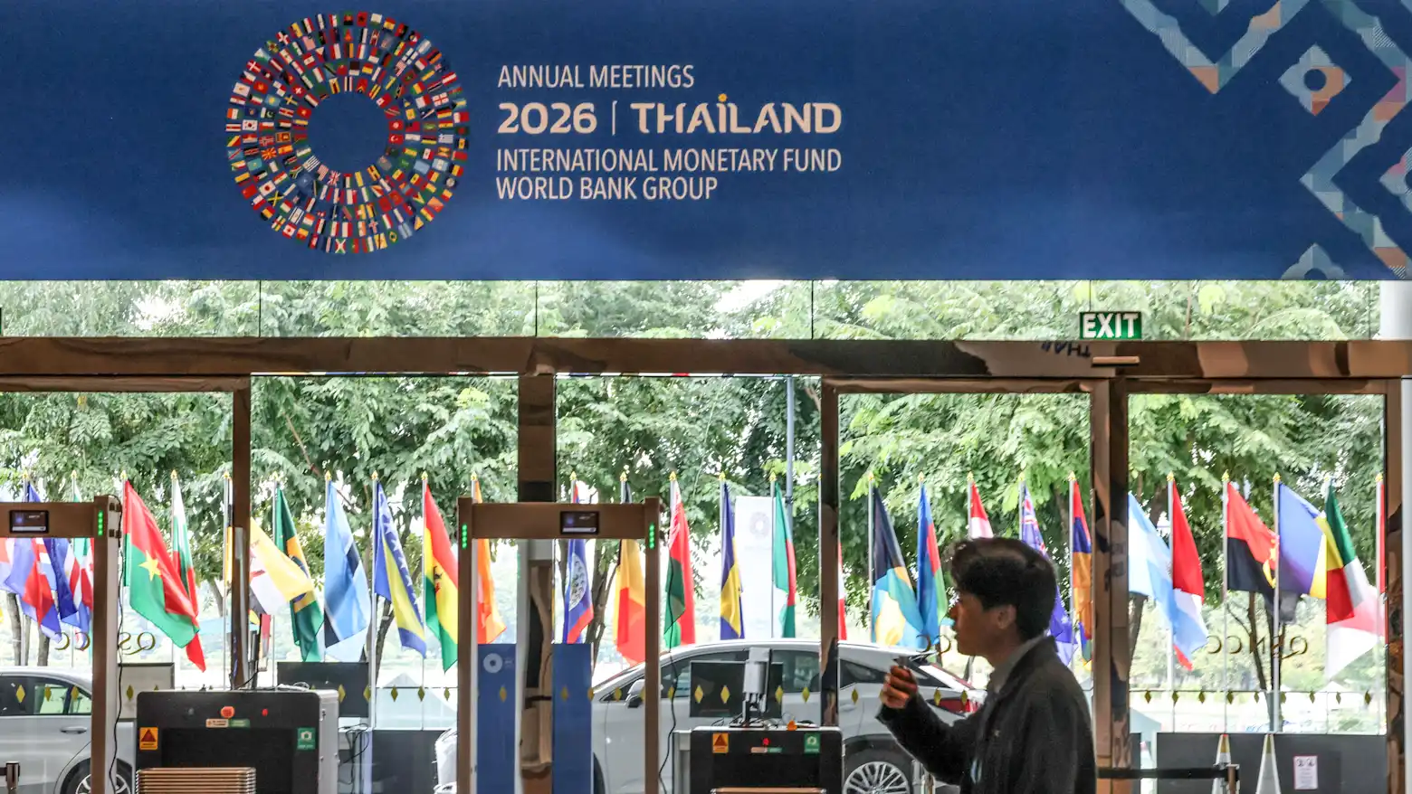 Entrance to the IMF-World Bank Group 2026 Annual Meetings venue in Bangkok, Thailand, with national flags and a security checkpoint