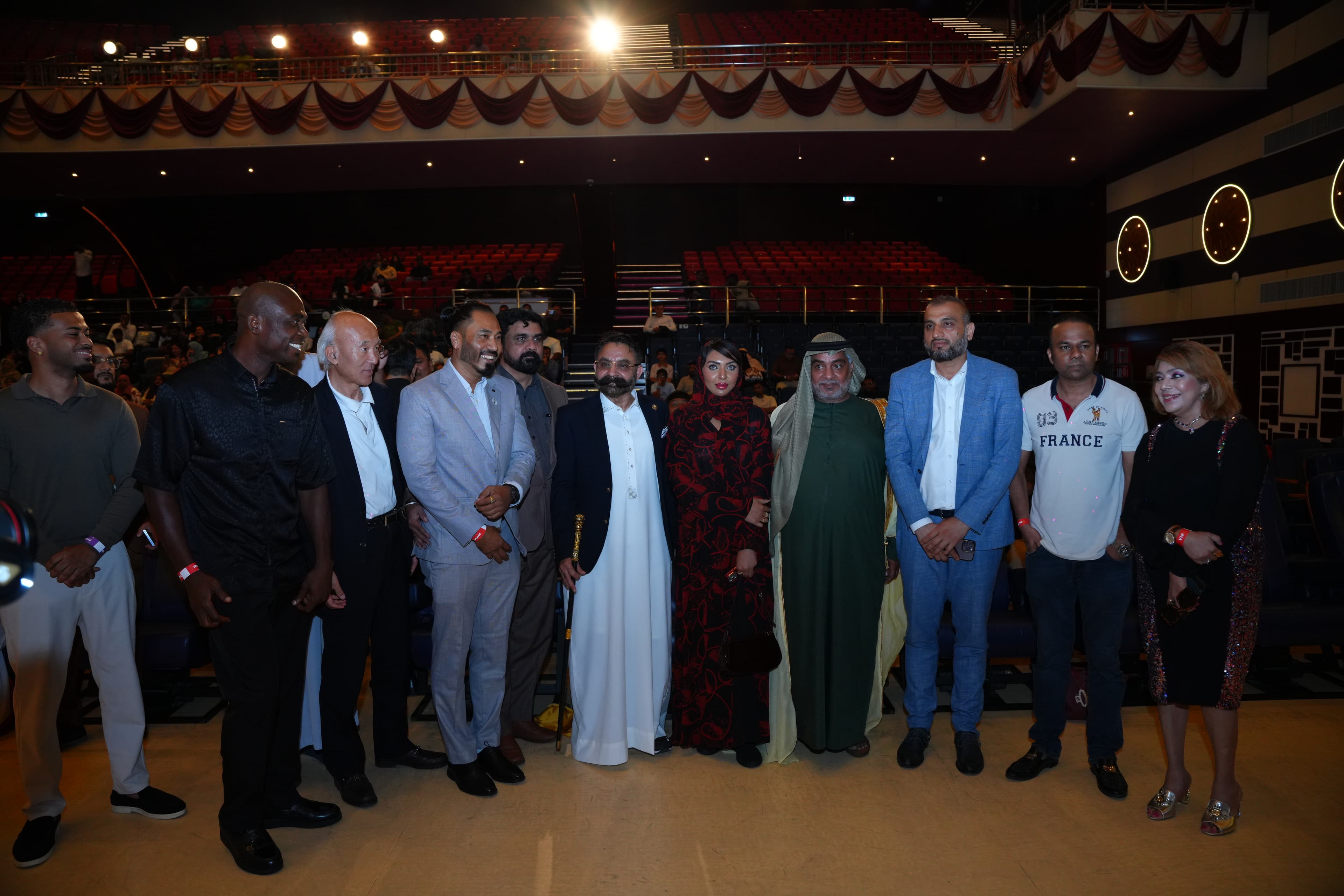 A line of attendees, including dignitaries and guests, posing together on stage at the OBS Global launch event in Dubai
