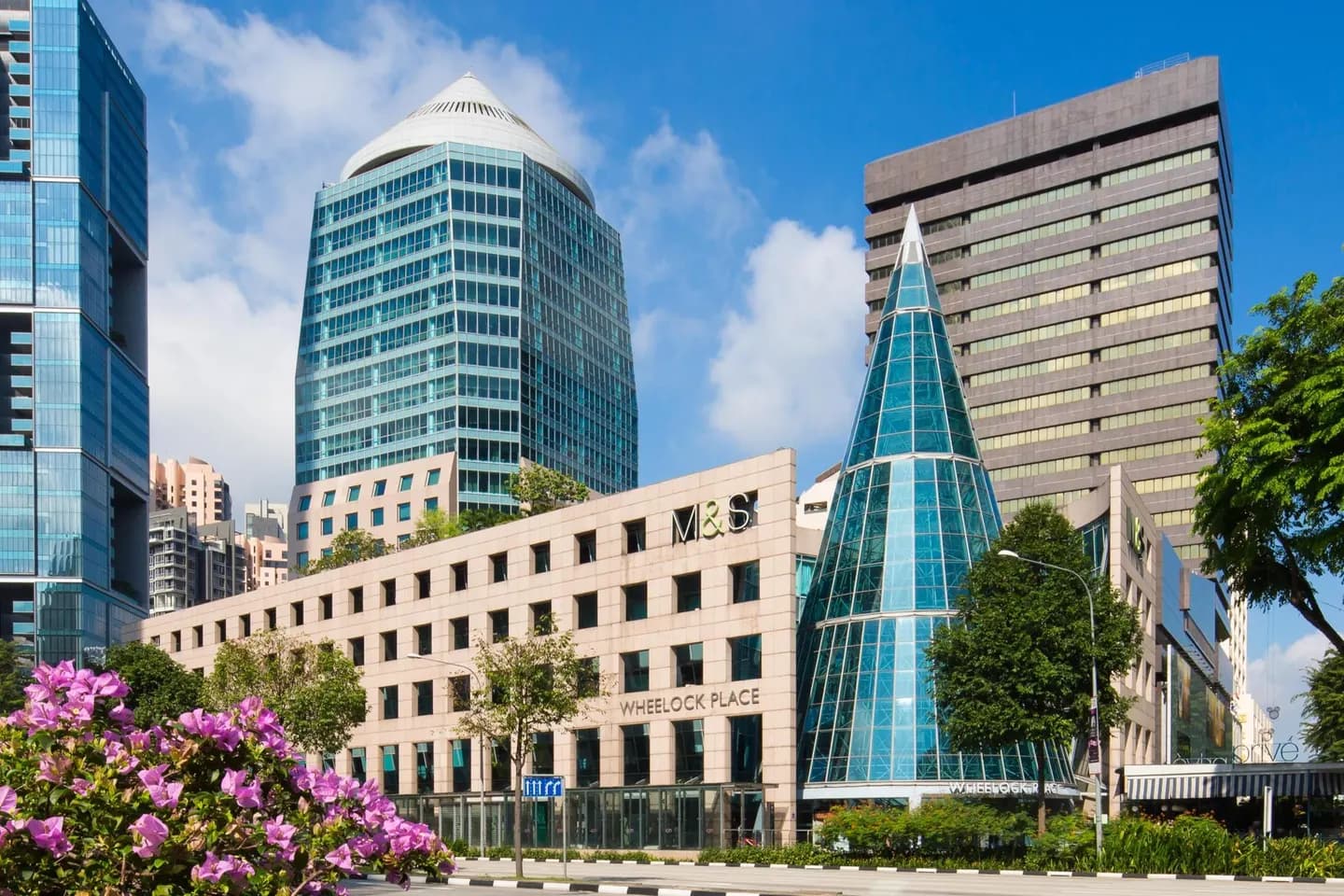 Wheelock Place on Singapore's Orchard Road, with its distinctive glass cone entrance and M&S store
