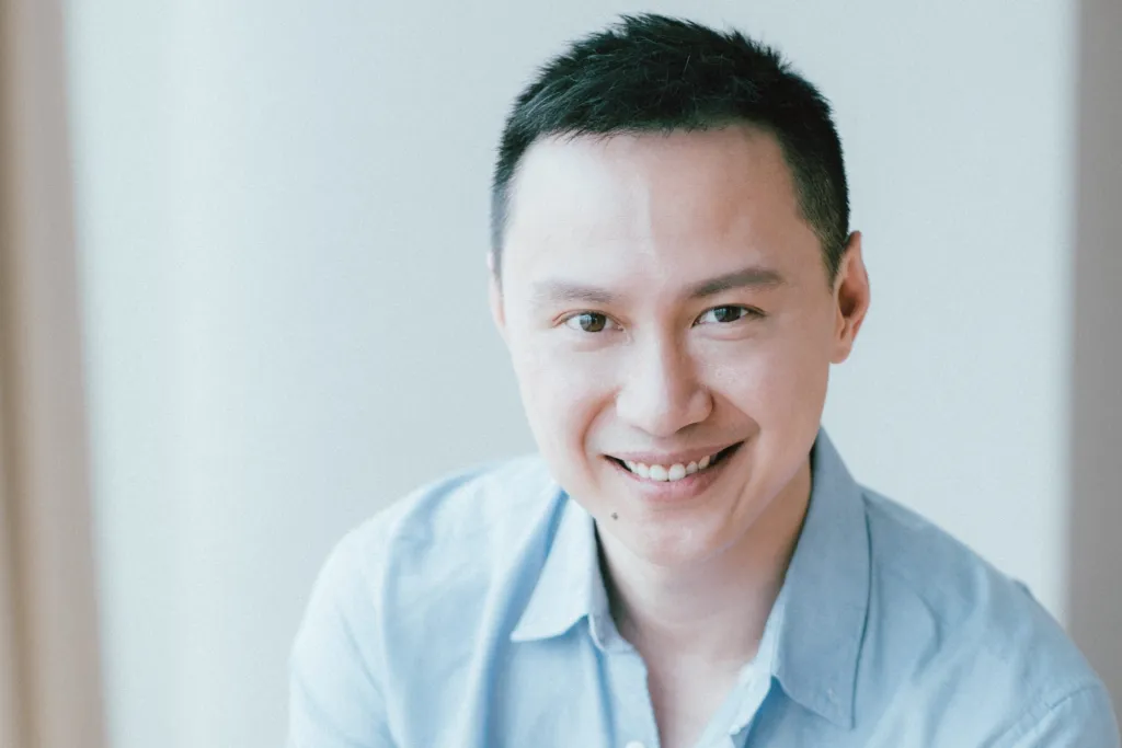Pak Sun Ting, founder and chief executive of Votee AI, smiling in a light blue shirt